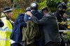 FILE - Members of the Jewish community comfort each other near to the Heaton Park Hebrew Congregation synagogue, in Crumpsall, Manchester, England, Thursday, Oct. 2, 2025 after Police reported that two people were killed and three others were seriously injured in a synagogue attack in northern England. (Peter Byrne/PA via AP, File)