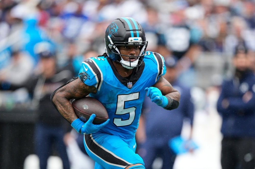 Carolina Panthers running back Rico Dowdle carries the ball in the second half of an NFL football game against the Dallas Cowboys, Sunday, Oct. 12, 2025, in Charlotte, N.C. (AP Photo/Jacob Kupferman)
