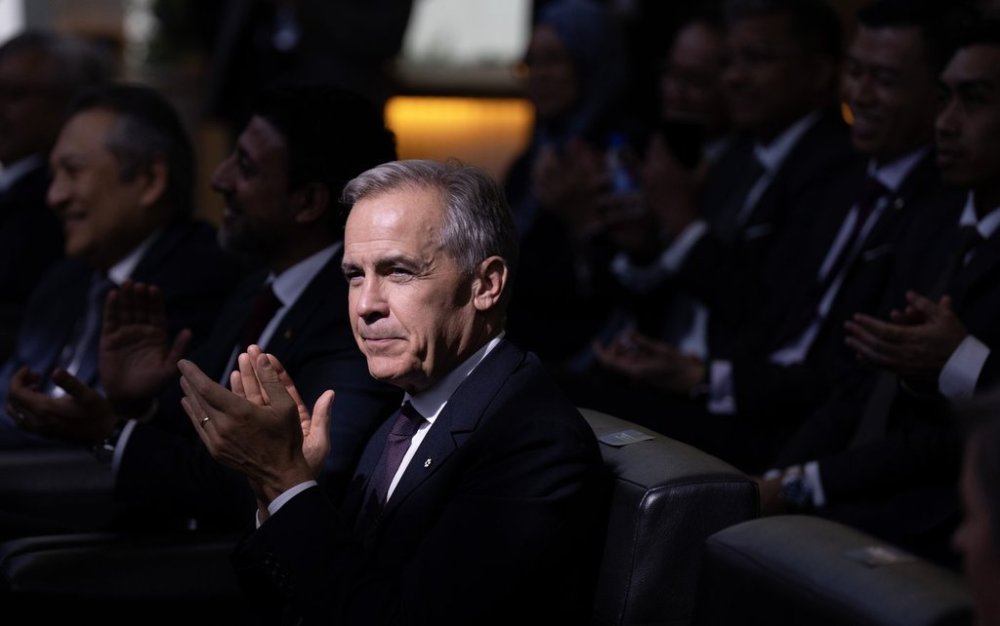 Prime Minister Mark Carney as he watches a signing ceremony at the CAE training facility in Kuala Lumpur, Monday, Oct. 27, 2025. THE CANADIAN PRESS/Adrian Wyld
