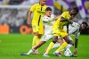 Real Madrid's Vinicius Junior, right, and Dani Ceballos, second from left, challenge for the ball with Villarreal's Santiago Mourino, left, and Pape Gueye during the Spanish La Liga soccer match between Real Madrid and Villarreal at the Santiago Bernabeu stadium in Madrid, Spain, Saturday, Oct. 4, 2025. (AP Photo/Manu Fernandez)