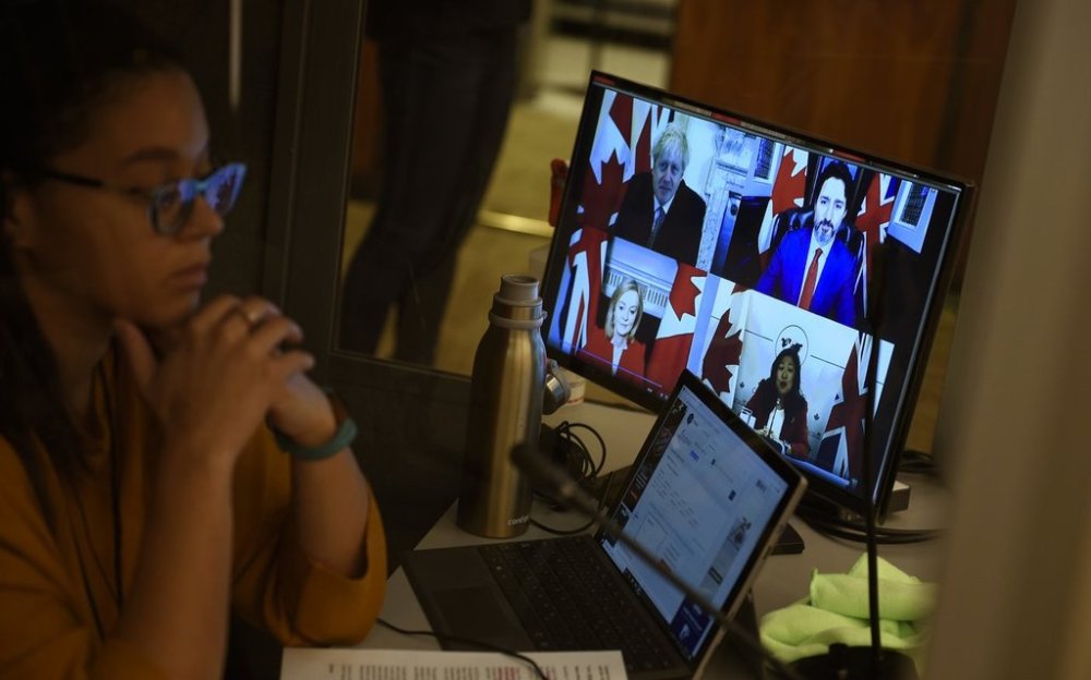 An interpreter works during a news conference in Ottawa on Saturday, Nov. 21, 2020. THE CANADIAN PRESS/Justin Tang