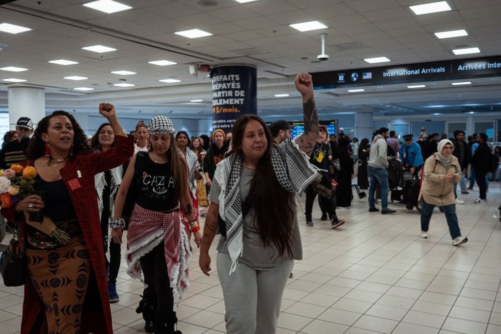 Mskwaasin Agnew, centre, joins with supporters after her arrival in Canada at Toronto Pearson International Airport, following her detention by Israel, in a Saturday, Oct. 11, 2025, handout photo. THE CANADIAN PRESS/Handout - Joshua Best (Mandatory Credit)