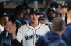 Seattle Mariners pitcher George Kirby walks in the dugout after being pulled during the sixth inning in Game 5 of baseball's American League Division Series against the Detroit Tigers, Friday, Oct. 10, 2025, in Seattle. (AP Photo/Lindsey Wasson)