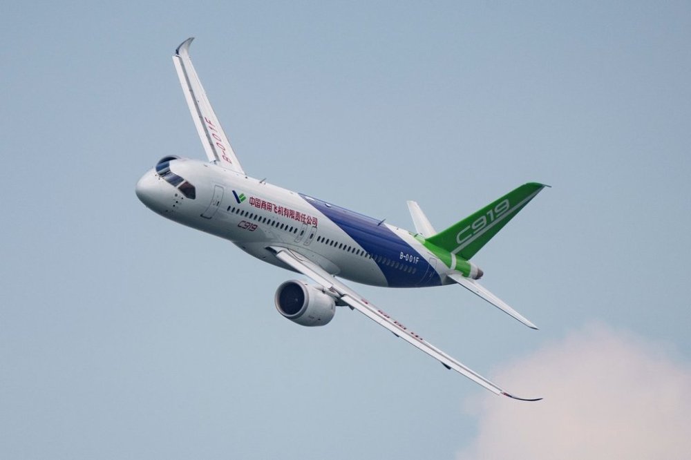 FILE - A COMAC C919 aircraft flies during the first day of the Singapore Airshow in Singapore, Feb. 20, 2024. (AP Photo/Vincent Thian, File)