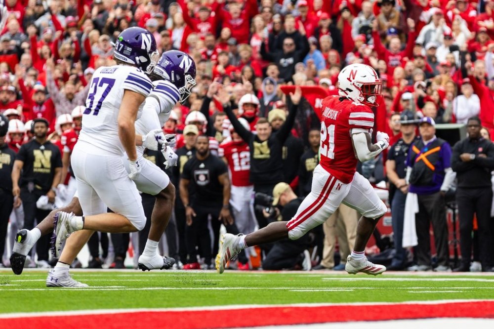Nebraska running back Emmett Johnson (21) runs in for a touchdown against Northwestern during the first half of an NCAA college football game, Saturday, Oct. 25, 2025, in Lincoln, Neb. (AP Photo/Bonnie Ryan)