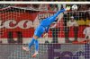 Tottenham's goalkeeper Guglielmo Vicario makes a save during a Champions League opening phase soccer match between Monaco and Tottenham Hotspur in Monaco, Wednesday, Oct. 22, 2025. (AP Photo/Philippe Magoni)