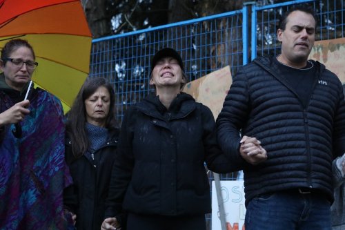 Katie Pasitney, the daughter of one of the co-owners of Universal Ostrich Farms, participates in a group prayer in Edgewood, B.C., following the announcement that the Supreme Court of Canada had declined to hear the farm’s appeal against an order to cull more than 300 of its ostriches on Thursday, Nov. 6, 2025. THE CANADIAN PRESS/Aaron Hemens