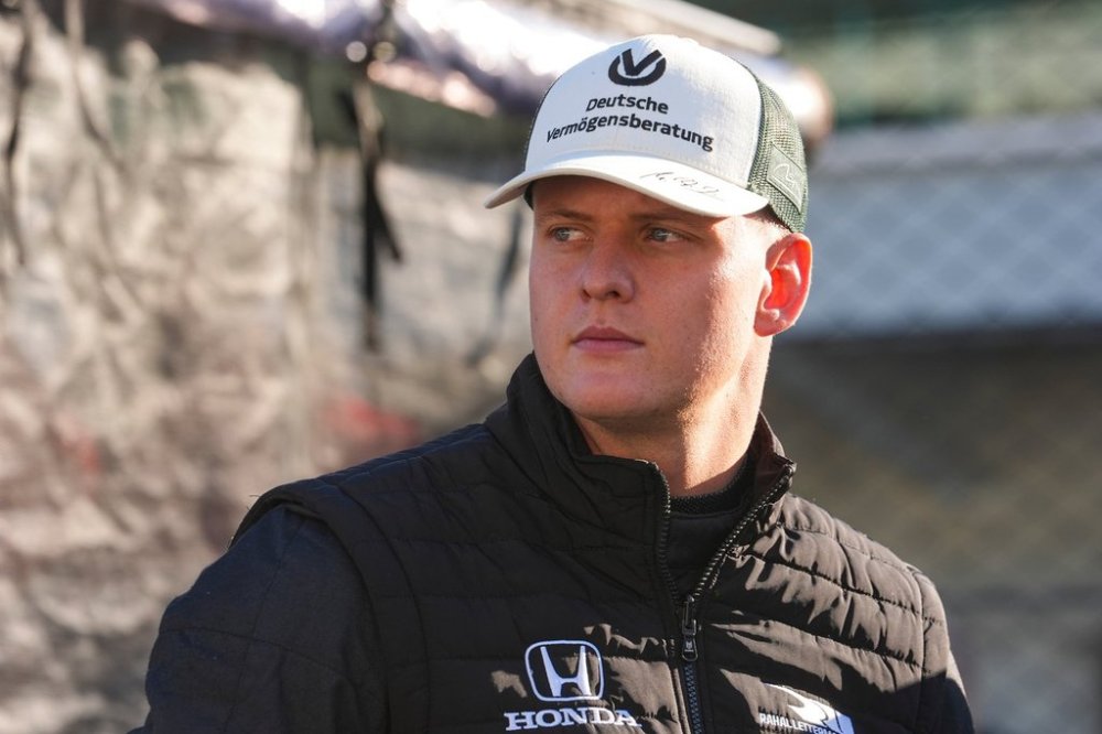 Race driver Mick Schumacher watches from the pit area as he participates in auto racing testing on the road coarse at Indianapolis Motor Speedway, Monday, Oct. 13, 2025, in Indianapolis. (AP Photo/Michael Conroy)