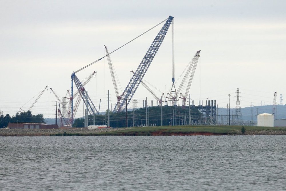 FILE - V.C. Summer Nuclear Station's unit two is shown under construction near Jenkinsville, S.C., during a media tour of the facility Wednesday, Sept. 21, 2016. (AP Photo/Chuck Burton)