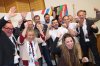 Athletes, politicians and officials react after the announcement of the first projections on the result of the referendum on the city's Olympic bid at the Haus des Sports in Munich, on Sunday, Oct. 26, 2025. (Karl-Josef Hildenbrand/dpa via AP)