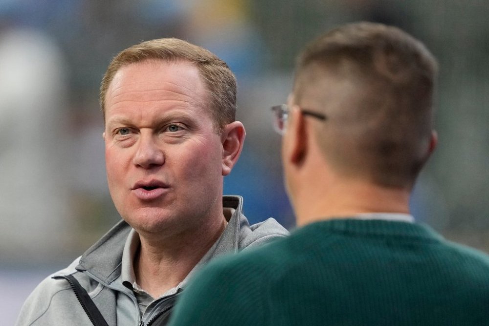 FILE - Milwaukee Brewers general manager Matt Arnold talks before a baseball game against the Cincinnati Reds, April 5, 2025, in Milwaukee. (AP Photo/Aaron Gash, File)