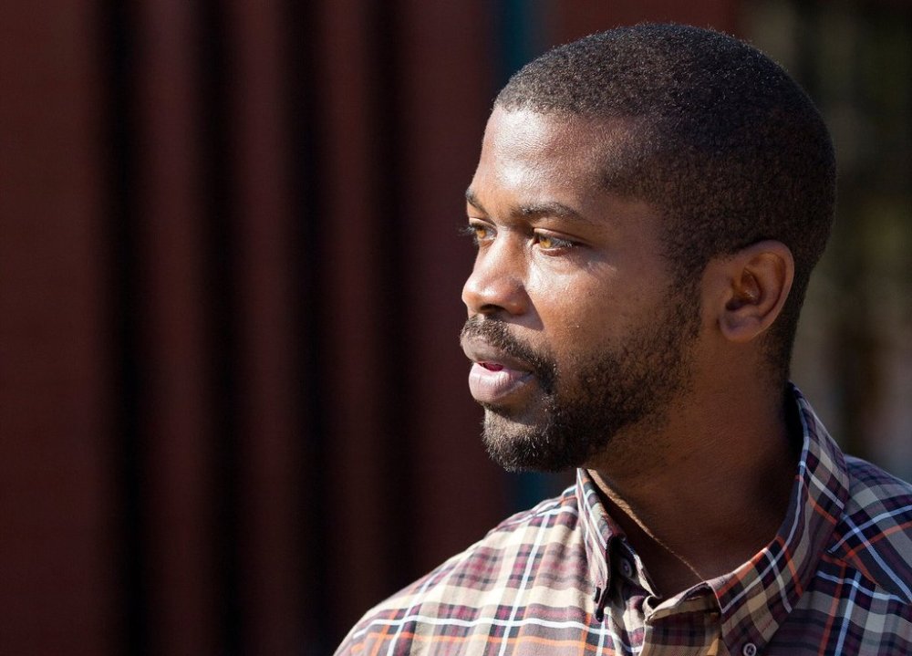 CORRECTS SOURCE TO NEWS&RECORD = N.C. House Rep. Cecil Brockman talks with early voters at Brown Recreation Center, on Wednesday, Nov. 2, 2016, in Greensboro, N.C. (Joseph Rodriguez/News & Record via AP)