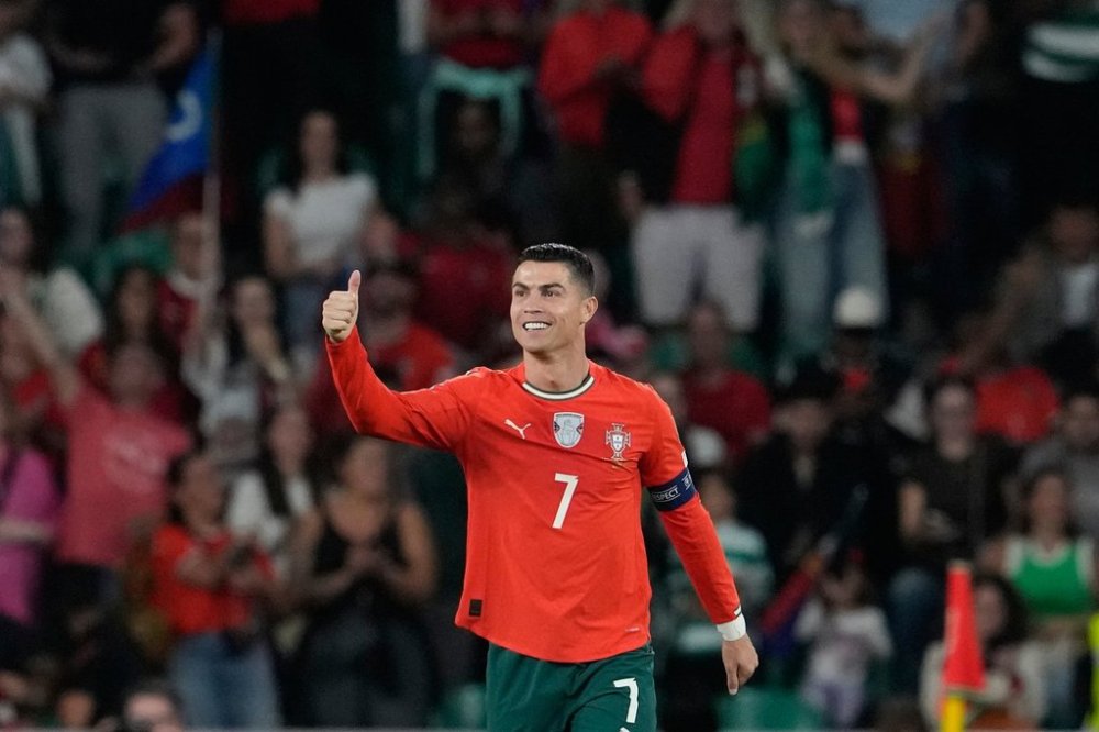 Portugal's Cristiano Ronaldo celebrates after scoring during a World Cup 2026 group F qualifying soccer match between Portugal and Hungary in Lisbon, Tuesday, Oct. 14, 2025. (AP Photo/Armando Franca)