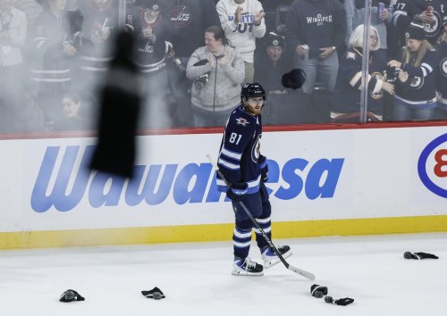 Winnipeg Jets' Kyle Connor (81) celebrates his hat trick against the Dallas Stars during third period NHL action in Winnipeg on Thursday, October 9, 2025. THE CANADIAN PRESS/John Woods