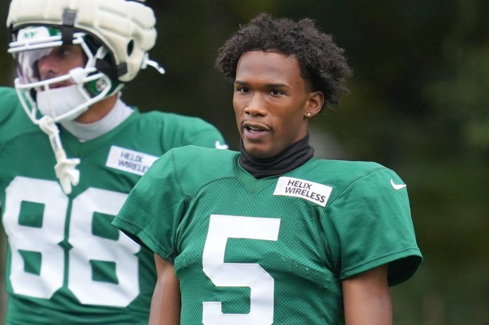 New York Jets wide receiver Garrett Wilson (5) watches during NFL football practice at The Grove in Watford, England, Wednesday, Oct. 8, 2025. (AP Photo/Kin Cheung)