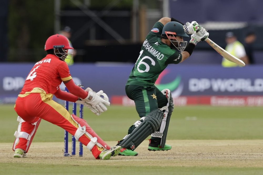 Pakistan's Mohammad Rizwan, right, bats during the ICC Men's T20 World Cup cricket match between Pakistan and Canada at the Nassau County International Cricket Stadium in Westbury, New York, Tuesday, June 11, 2024. (AP Photo/Adam Hunger)