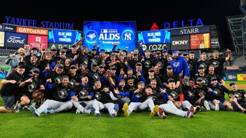 The Toronto Blue Jays gather for a group photo on the field after beating the New York Yankees in Game 4 of baseball's American League Division Series, in New York, Wednesday, Oct. 8, 2025. THE CANADIAN PRESS/AP-Yuki Iwamura