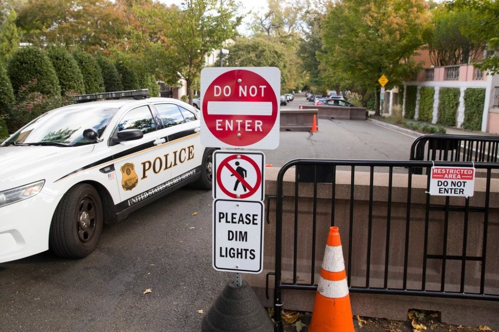 FILE - An officer with the Uniform Division of the United States Secret Service sits in his car at a checkpoint near the home of President Barack Obama, Oct. 24, 2018, in Washington. (AP Photo/Alex Brandon, File)