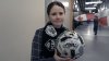Northern Super League co-founder Diana Matheson shows off a gift from a fan, in this handout photo, at B.C. Place Stadium during the Northern Super League's inaugural game between the Vancouver Rise and Calgary Wild, on April 16, 2025. THE CANADIAN PRESS/Handout — The Pitch (Mandatory Credit)