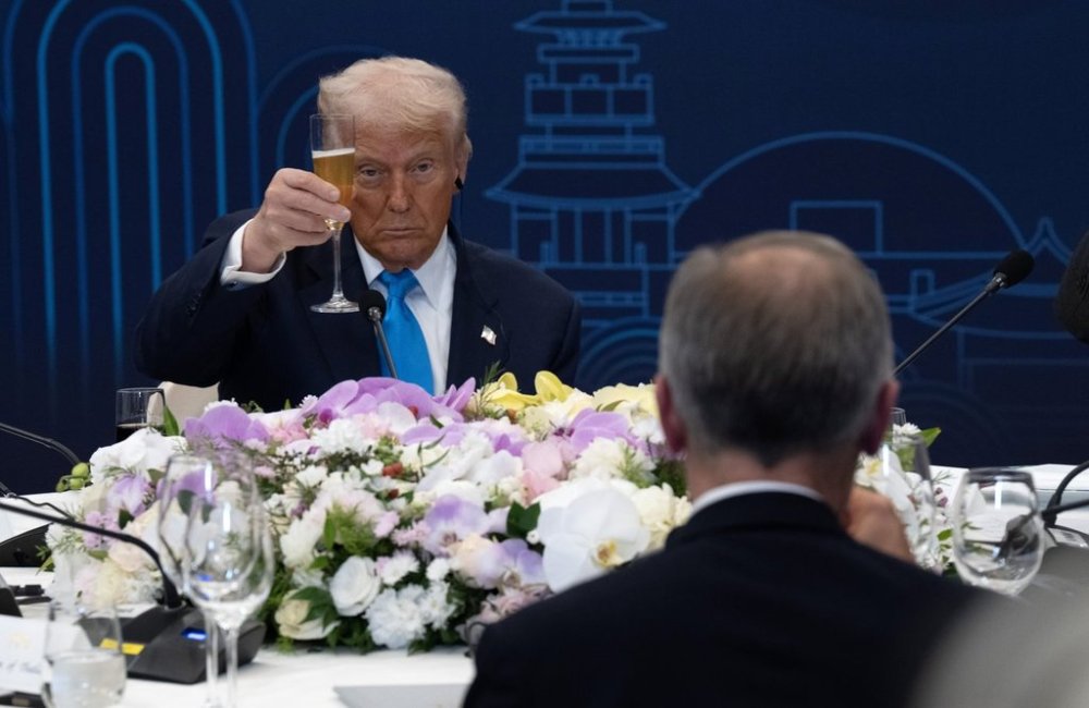 United States President Donald Trump looks towards Canadian Prime Minister Mark Carney as they raise their glasses during a toast at a working dinner in Gyeongju, South Korea on Wednesday, Oct 29, 2025. They were among a small group of world leaders invited to a dinner hosted by South Korean President Lee Jae-Myung. THE CANADIAN PRESS/Adrian Wyld