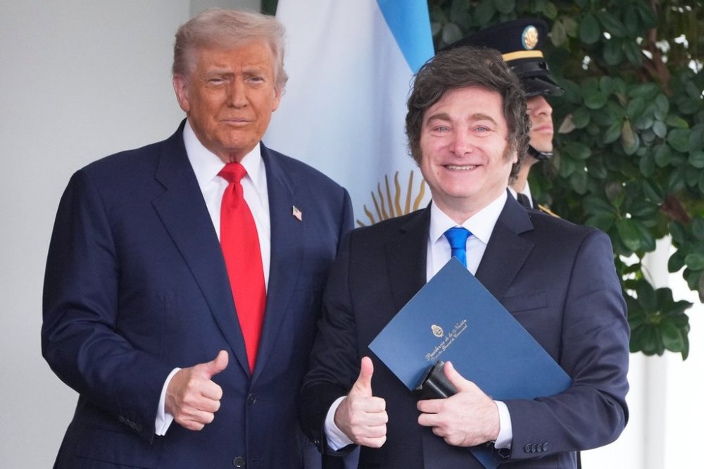 President Donald Trump greets Argentina's President Javier Milei, as he arrives at the White House, Tuesday, Oct. 14, 2025, in Washington. (AP Photo/Mark Schiefelbein)