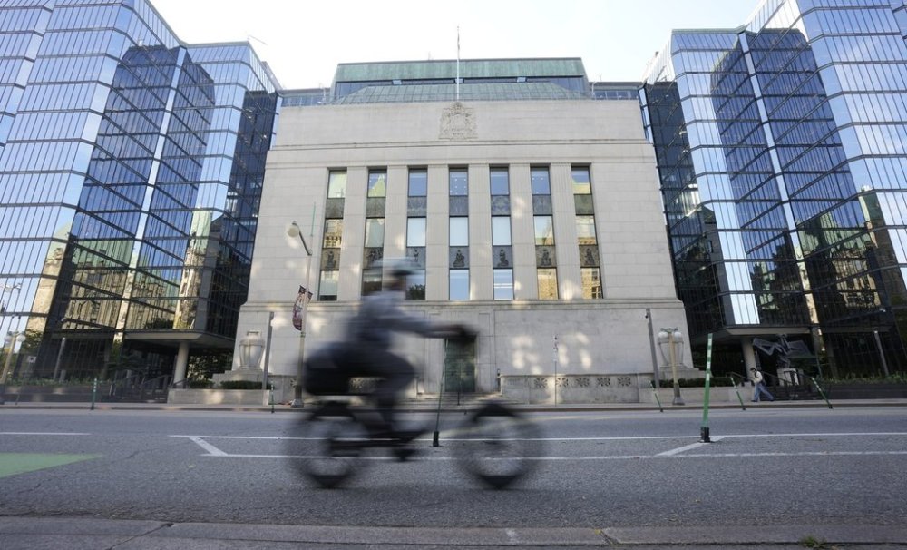 A cyclist rides past the Bank of Canada in Ottawa, Wednesday, Sept. 17, 2025. THE CANADIAN PRESS/Adrian Wyld