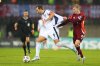 Latvia's Maksims Tonisevs, right, pulls the shirt of England's Harry Kane during the 2026 World Cup group K qualifying soccer match between Latvia and England in Riga, Latvia, Tuesday, Oct. 14, 2025. (AP Photo/Roman Koksarov)