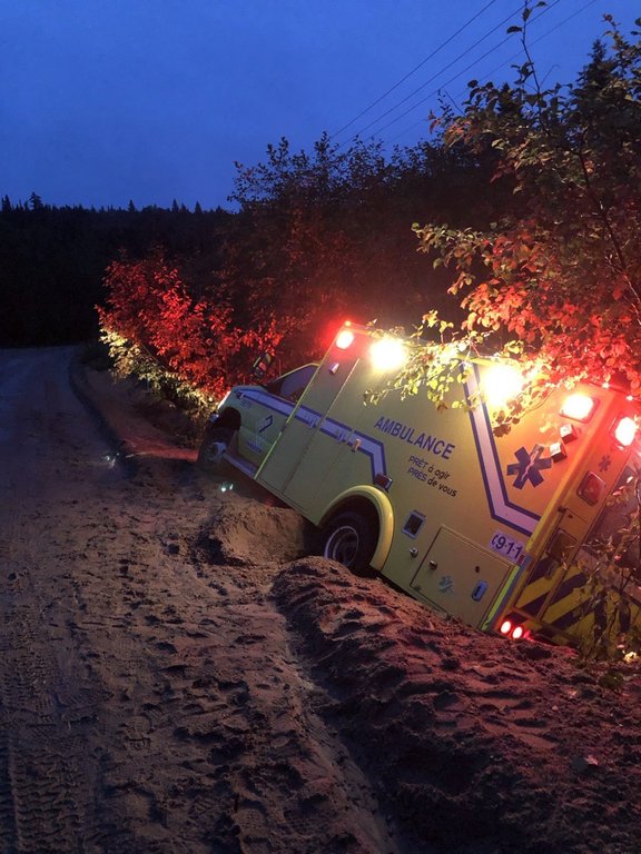 An ambulance is shown in the ditch on a stretch of Manawan Road, in Quebec, is shown in this undated handout photo. The Atikamekw Council of Manawan has launched legal action against the Quebec government over its inaction over repairs to the only road that links the remote community to southern Quebec. THE CANADIAN PRESS/Handout - Atikamekw Council of Manawan (Mandatory credit)