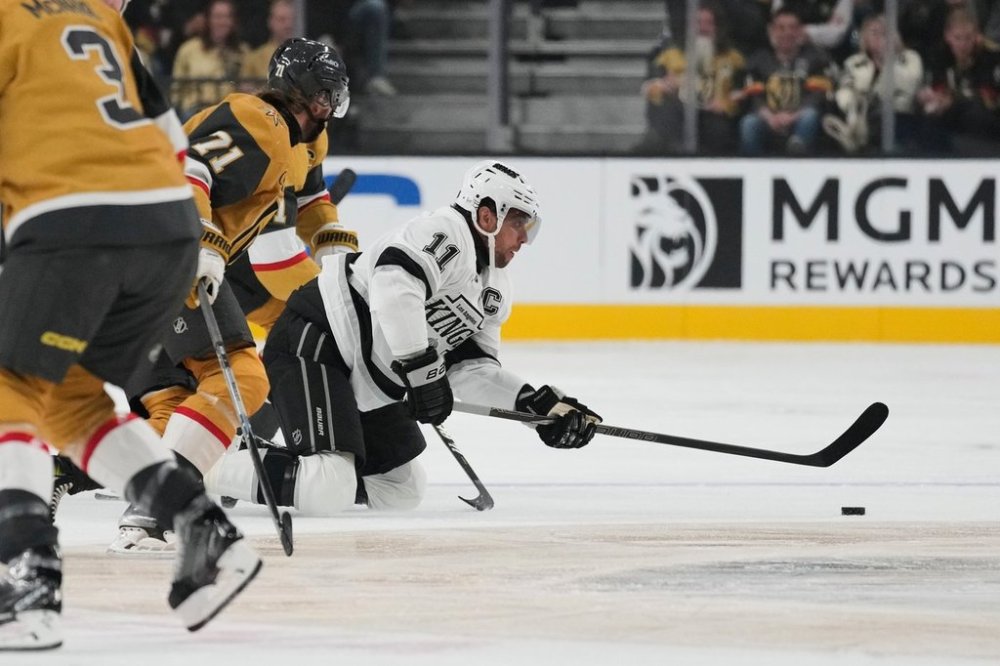 Los Angeles Kings center Anze Kopitar (11) passes against the Vegas Golden Knights during the first period of an NHL hockey game Wednesday, Oct. 8, 2025, in Las Vegas. (AP Photo/John Locher)