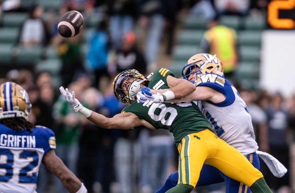 Winnipeg Blue Bombers' Evan Holm (right) and Edmonton Elks' Gavin Cobb (85) jump for the incomplete pass during first half CFL action in Edmonton, on Saturday September 21, 2024. THE CANADIAN PRESS/Jason Franson
