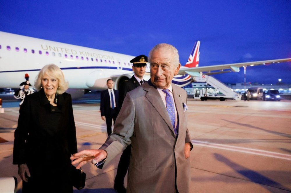 Britain's King Charles III and Queen Camilla arrive at Ciampino 31st Wing Airport in the outskirts of Rome, Wednesday, Oct. 22, 2025, a day before their state visit to the Vatican. (Cecilia Fabiano/ Lapresse via AP)