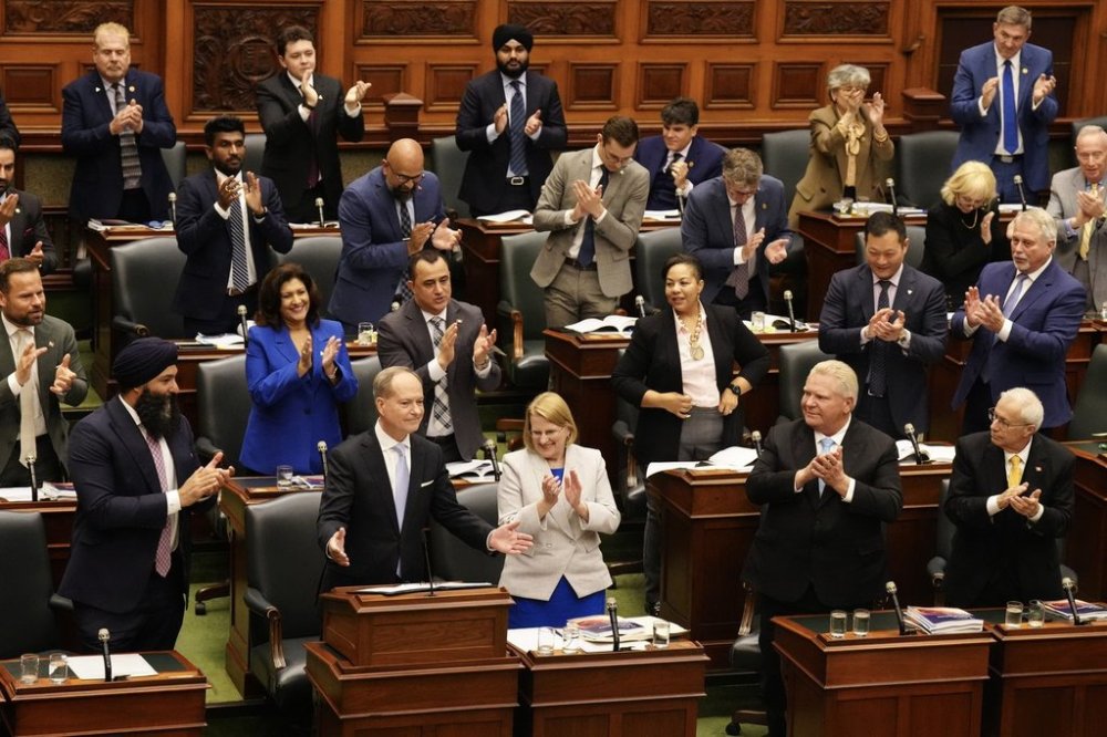 Ontario Finance Minister Peter Bethlenfalvy gestures to the house as Premier Doug Ford looks on, while delivering the budget, at the Queen's Park Legislature in Toronto, on Thursday, May 15, 2025. THE CANADIAN PRESS/Chris Young