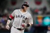 FILE - Japan third baseman Munetaka Murakami (55) runs the bases after hitting a home run during the second inning of a World Baseball Classic game against the United States, Tuesday, March 21, 2023, in Miami. (AP Photo/Marta Lavandier, File)