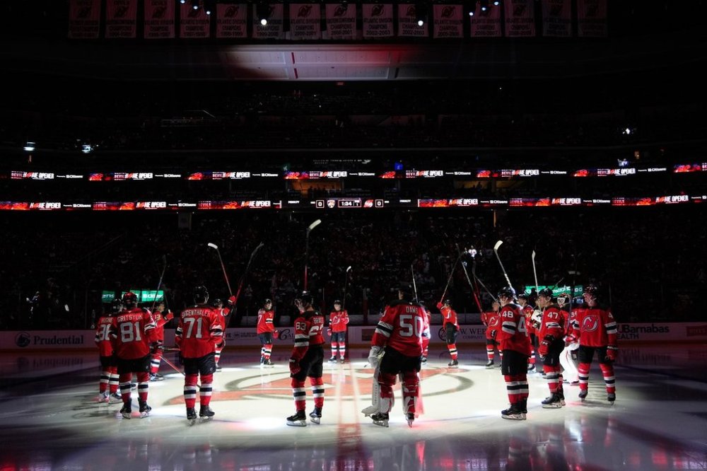The New Jersey Devils are introduced before their home opener NHL hockey game against the Florida Panthers Thursday, Oct. 16, 2025, in Newark, N.J. (AP Photo/Seth Wenig)
