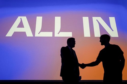 Minister of Artificial Intelligence and Digital Innovation Evan Solomon, left, shakes hands with Aidan Gomez of Cohere after participating in a talk at the All In AI conference in Montreal on Thursday, Sept. 25, 2025.  THE CANADIAN PRESS/Christopher Katsarov