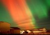 In a 30-second time exposure, the aurora borealis, or northern lights, illuminates the night sky Monday, Nov. 5, 2001, over Kalispell, Mont. The community, about five hours south of Calgary, has launched a campaign trying to woo Canadian visitors back. (AP Photo/Daily Inter Lake, Robin Loznak)