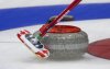 Canada skip Brad Gushue slows a rock during a practice session at the World Curling Championship, Friday, March 31, 2023 in Ottawa. THE CANADIAN PRESS/Adrian Wyld