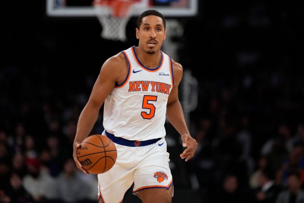 New York Knicks' Malcolm Brogdon (5) looks to pass during the first half of a preseason NBA basketball game against the Washington Wizards Monday, Oct. 13, 2025, in New York. (AP Photo/Frank Franklin II)