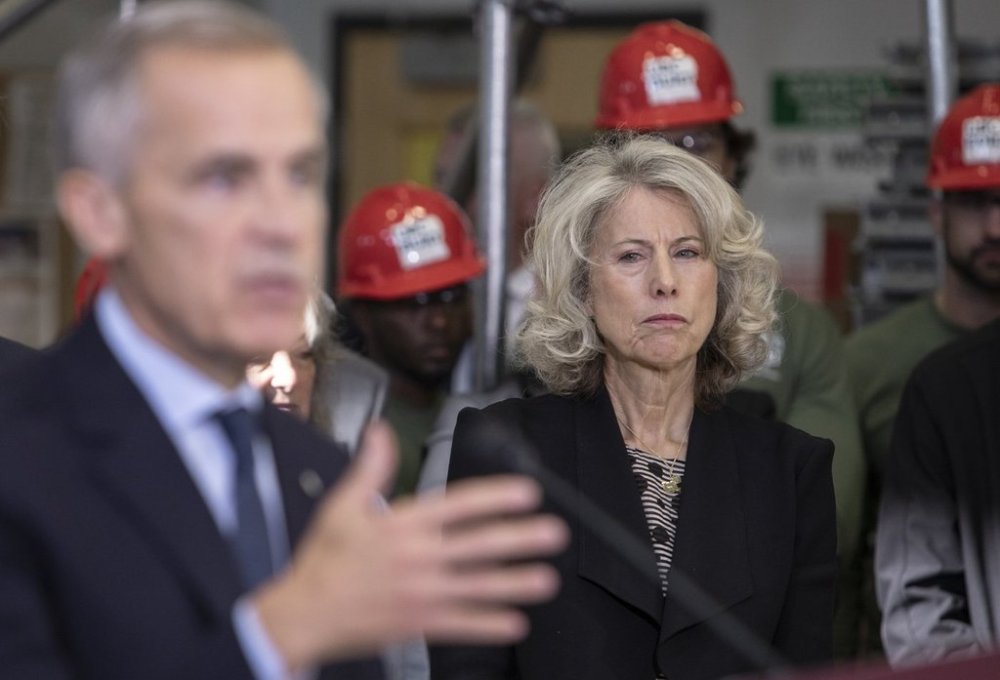 The head of the new federal government Major Projects Office Dawn Farrell listens as Prime Minister Mark Carney announces five major projects in Edmonton on Thursday, Sept. 11, 2025. THE CANADIAN PRESS/Amber Bracken