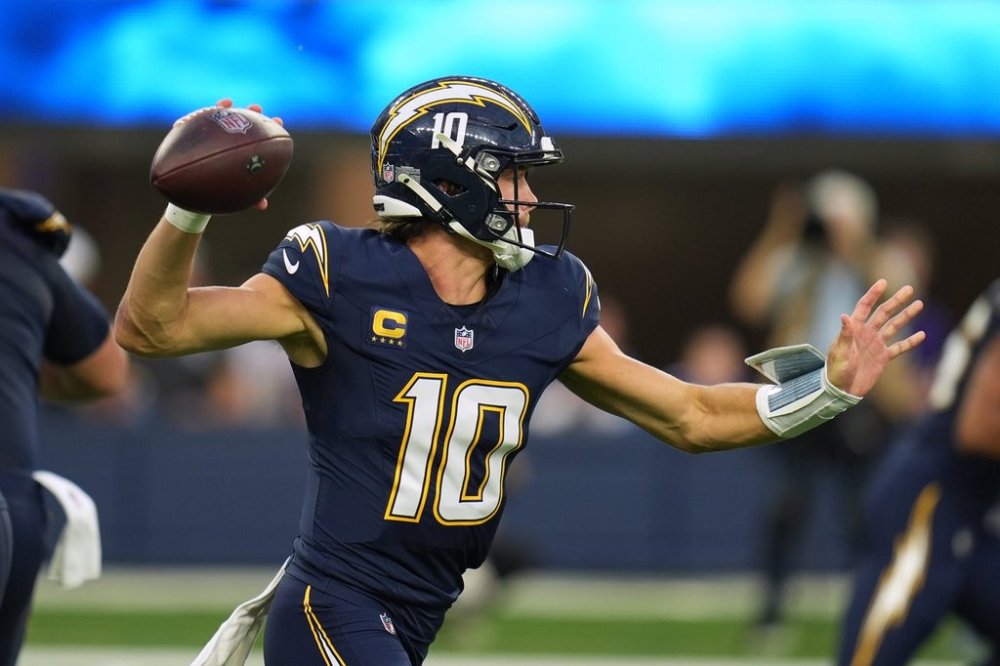 Los Angeles Chargers quarterback Justin Herbert (10) passes during the first half of an NFL football game against the Minnesota Vikings Thursday, Oct. 23, 2025, in Inglewood, Calif. (AP Photo/Gregory Bull)