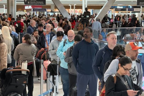 Travellers wait in long security lines at George Bush Intercontinental Airport, Monday, Nov. 3, 2025, in Houston. (AP Photo Lekan Oyekanmi)