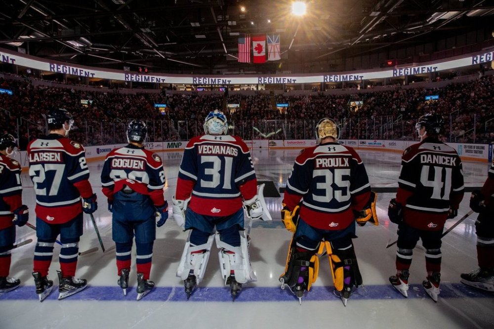 Newfoundland Regiment players stand along the blue line after player introductions before their Quebec Maritimes Junior Hockey League season opener at Mary Brown's Centre in St. John's in this Sept. 18, 2025 handout photo. THE CANADIAN PRESS/Handout - Jeff Parsons (Mandatory Credit)