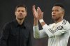 Real Madrid's head coach Xabi Alonso and Kylian Mbappe walk off the oitch after the Champions League soccer match between Liverpool and Real Madrid in Liverpool, England, Tuesday, Nov. 4, 2025. (AP Photo/Jon Super)