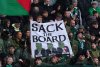 Celtic fans in the stands hold up a Sack The Board banner ahead of the William Hill Premiership soccer match against Dundee at Dens Park, Sunday Oct. 19, 2025. (Jane Barlow/PA via AP)
