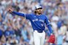Blue Jays pitcher Kevin Gausman (34) reacts to a flyout during the fifth inning of Game 1 in Major League Baseball's American League Division Series action against the New York Yankees in Toronto on Oct. 4, 2025. THE CANADIAN PRESS/Nathan Denette
