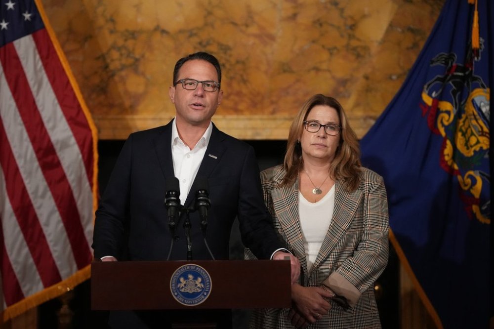 Pennsylvania Gov. Josh Shapiro, accompanied by his wife Lori Shapiro, speaks during a news conference after Cody Balmer plead guilty to attempted murder and other charges, on Tuesday, Oct. 14, 2025 in Harrisburg, Pa. (AP Photo/Matt Slocum)