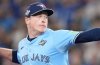 Toronto Blue Jays pitcher Louis Varland (77) delivers a pitch against the Los Angeles Dodgers during seventh inning Game 6 World Series playoff MLB baseball action in Toronto on Friday, Oct. 31, 2025. THE CANADIAN PRESS/Nathan Denette