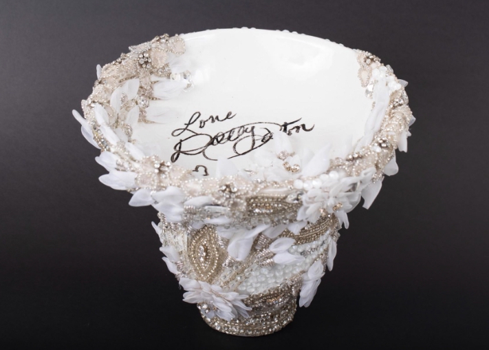 SUPPLIEDA bowl designed using pieces from one of Dolly Parton’s stage costumes and signed by the legendary singer.