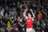 Arsenal's Declan Rice celebrates after a Premier League soccer match between Arsenal and Tottenham in London, Sunday, Nov. 23, 2025. (AP Photo/Frank Augstein)