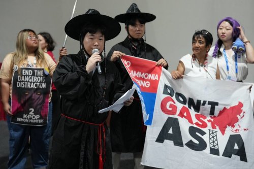 Activists participate in a demonstration calling for South Korea to stop funding fossil fuels during a Don't Gas Asia protest at the COP30 U.N. Climate Summit, Monday, Nov. 17, 2025, in Belem, Brazil. (AP Photo/Andre Penner)